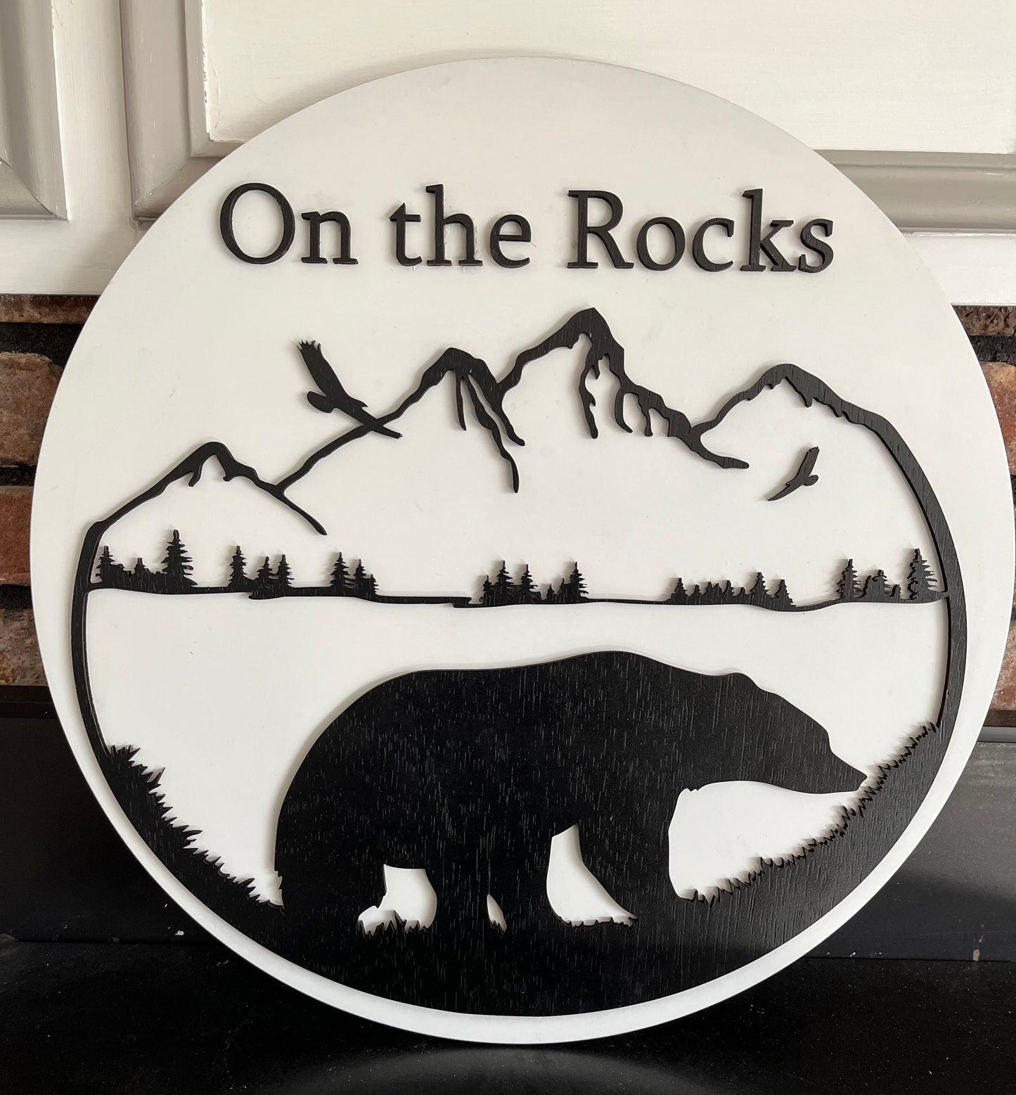 Bear on Rocks round sign