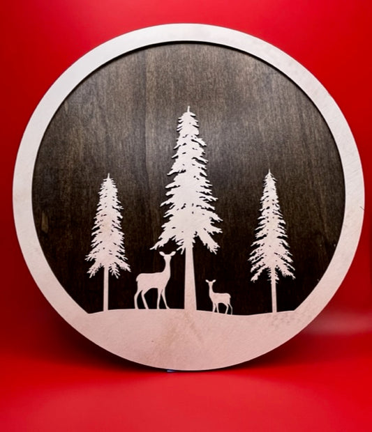 12" Round Deer with snow covered trees over a stained back ground